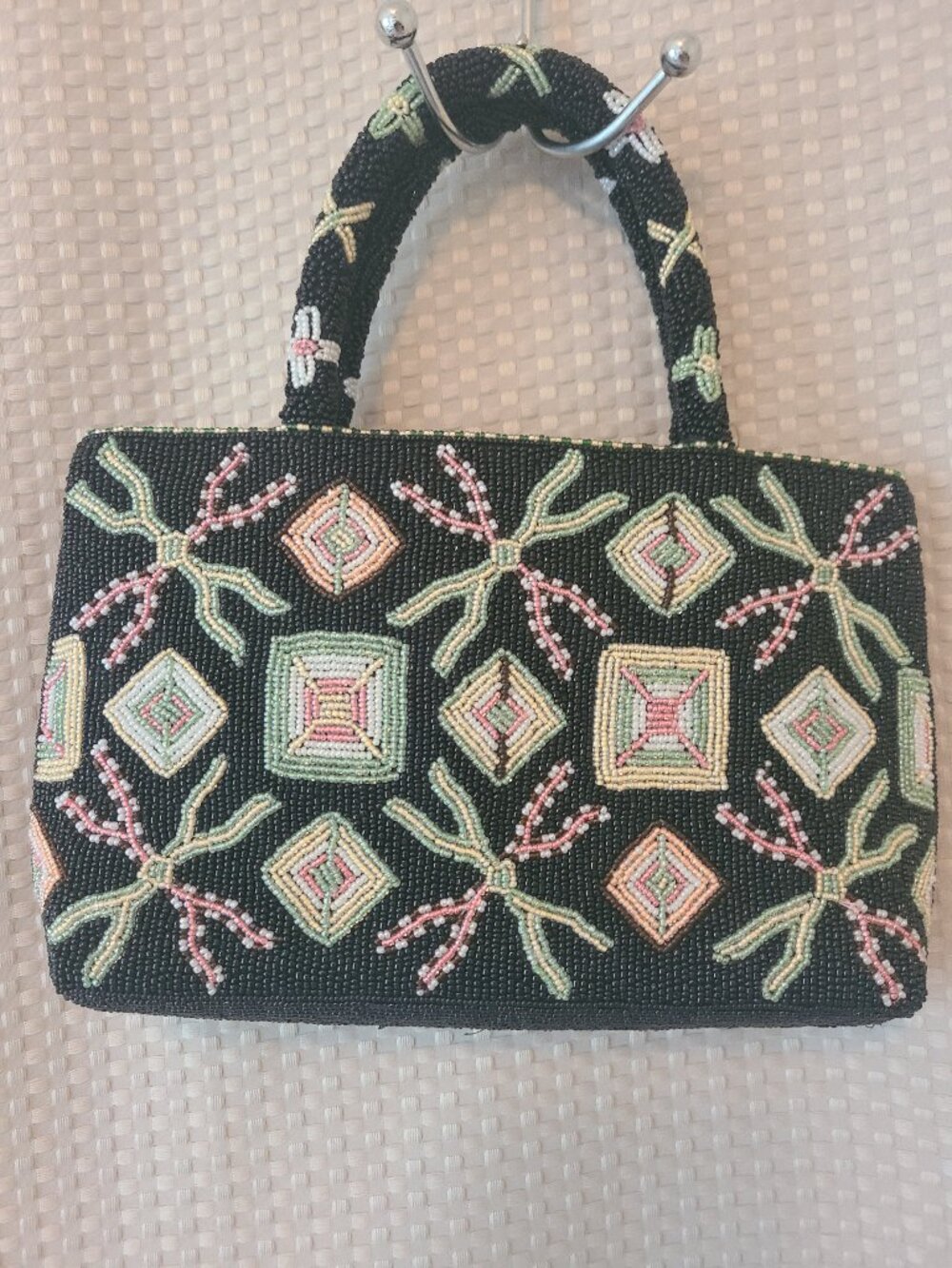 This is a vintage glass-beaded handbag